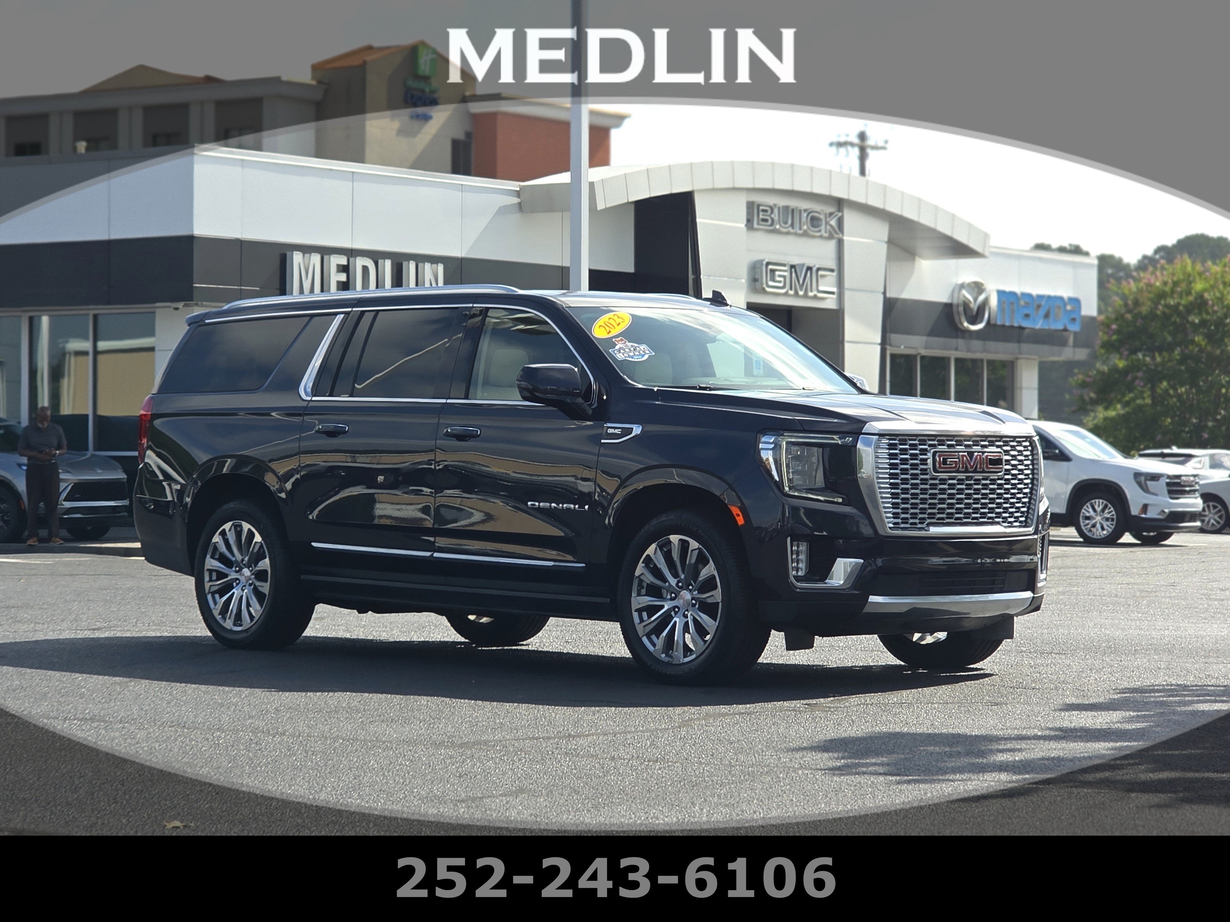 2023 GMC Yukon XL Denali in Titanium Rush Metallic — front three-quarter view