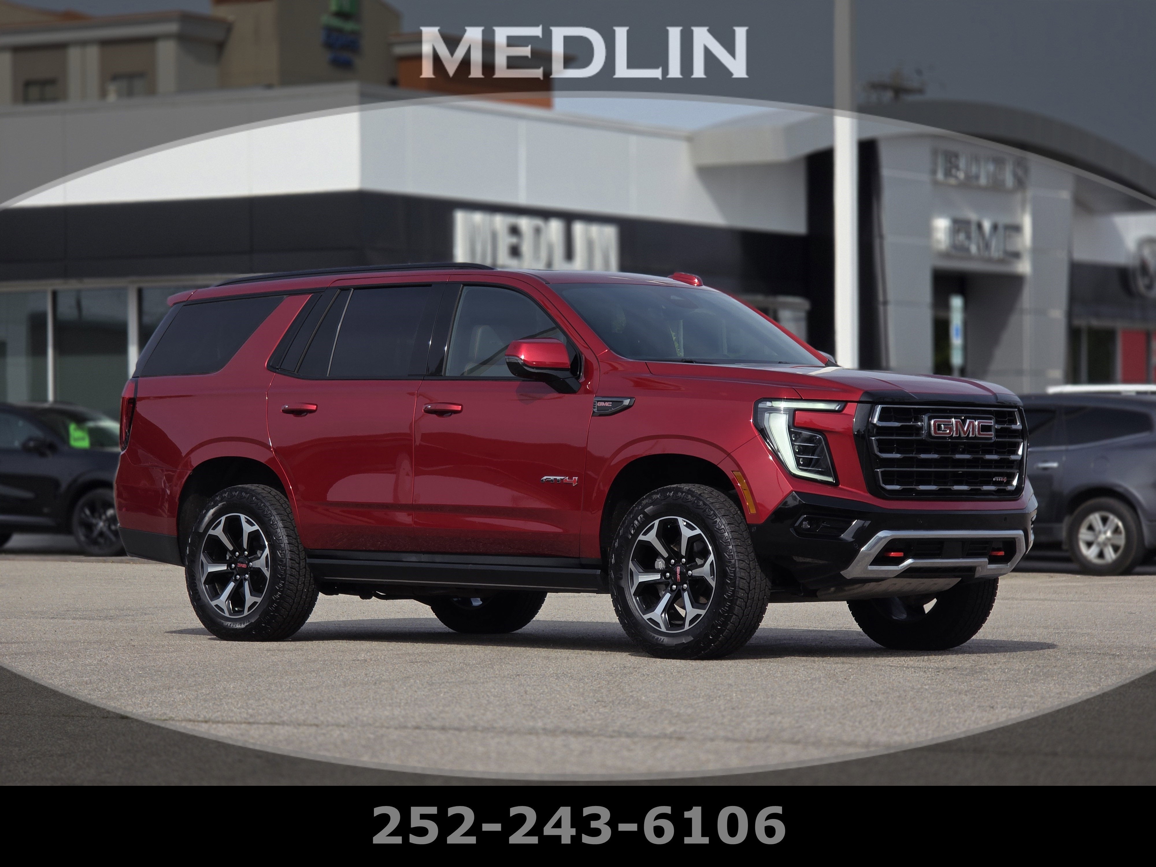 2025 GMC Yukon AT4 in Volcanic Red Tintcoat — front three-quarter view