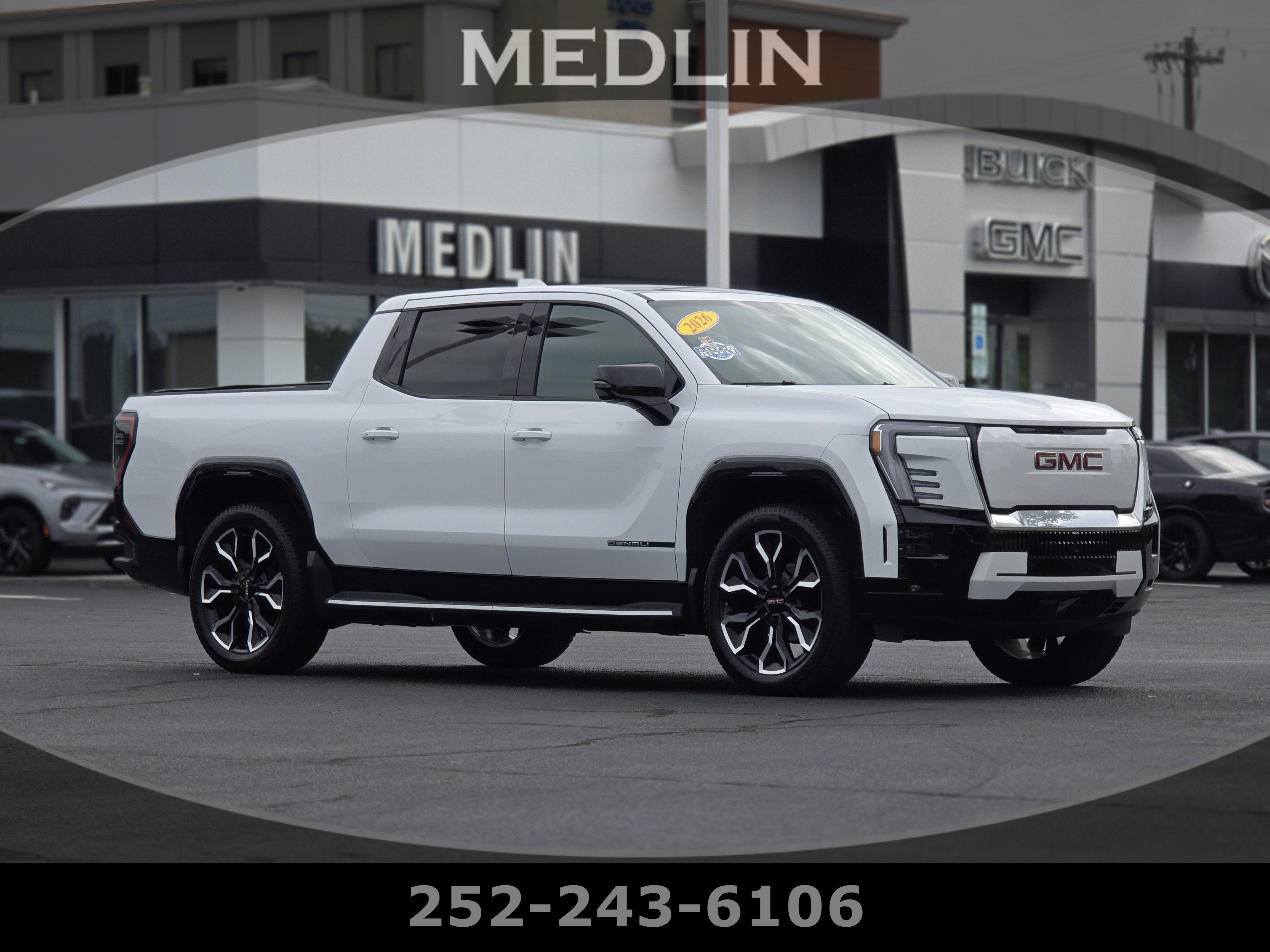 2026 GMC Sierra EV Denali Max Range in Summit White — front three-quarter view