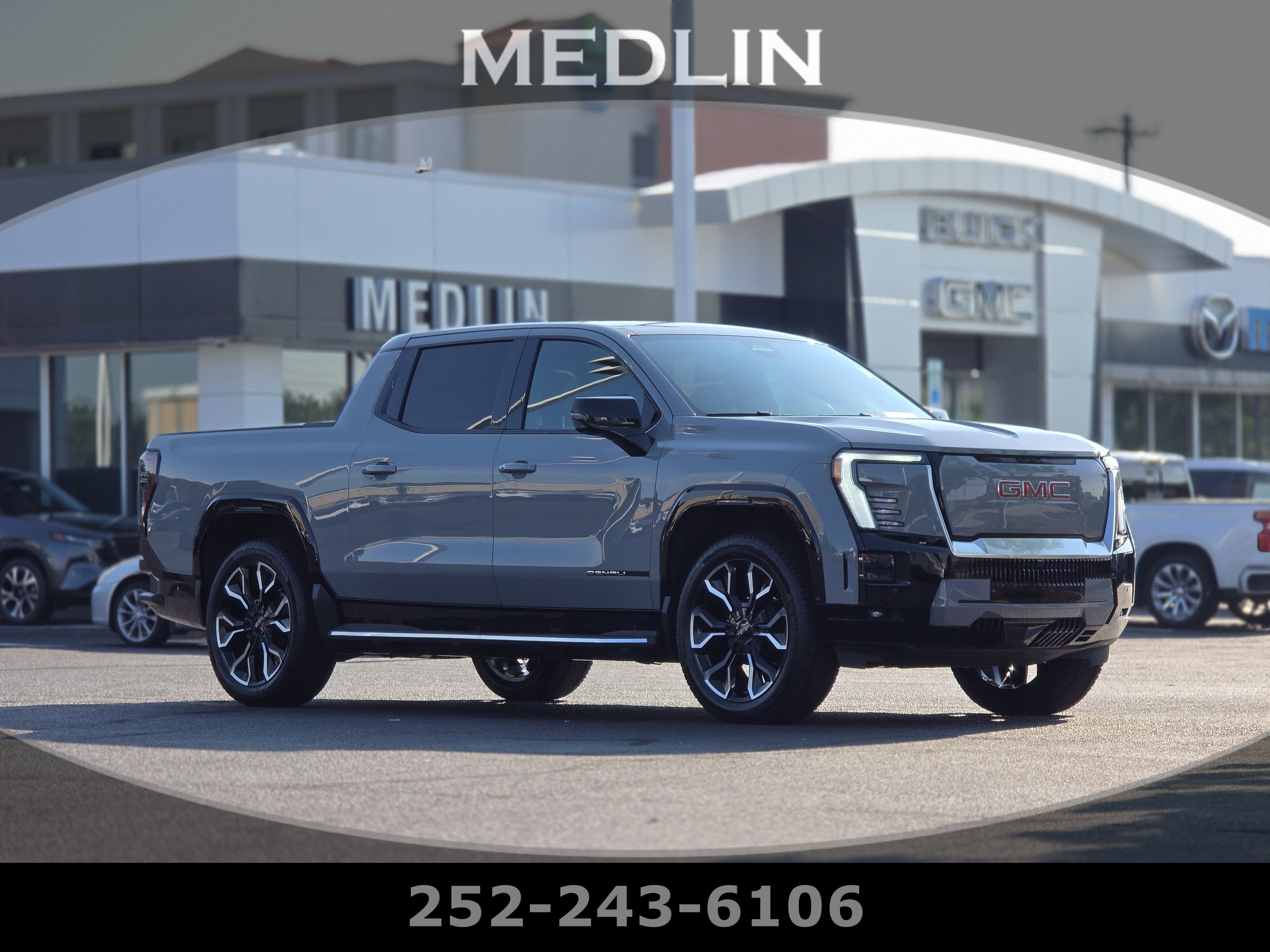 2026 GMC Sierra EV Denali Max Range in Thunderstorm Gray — front three-quarter view