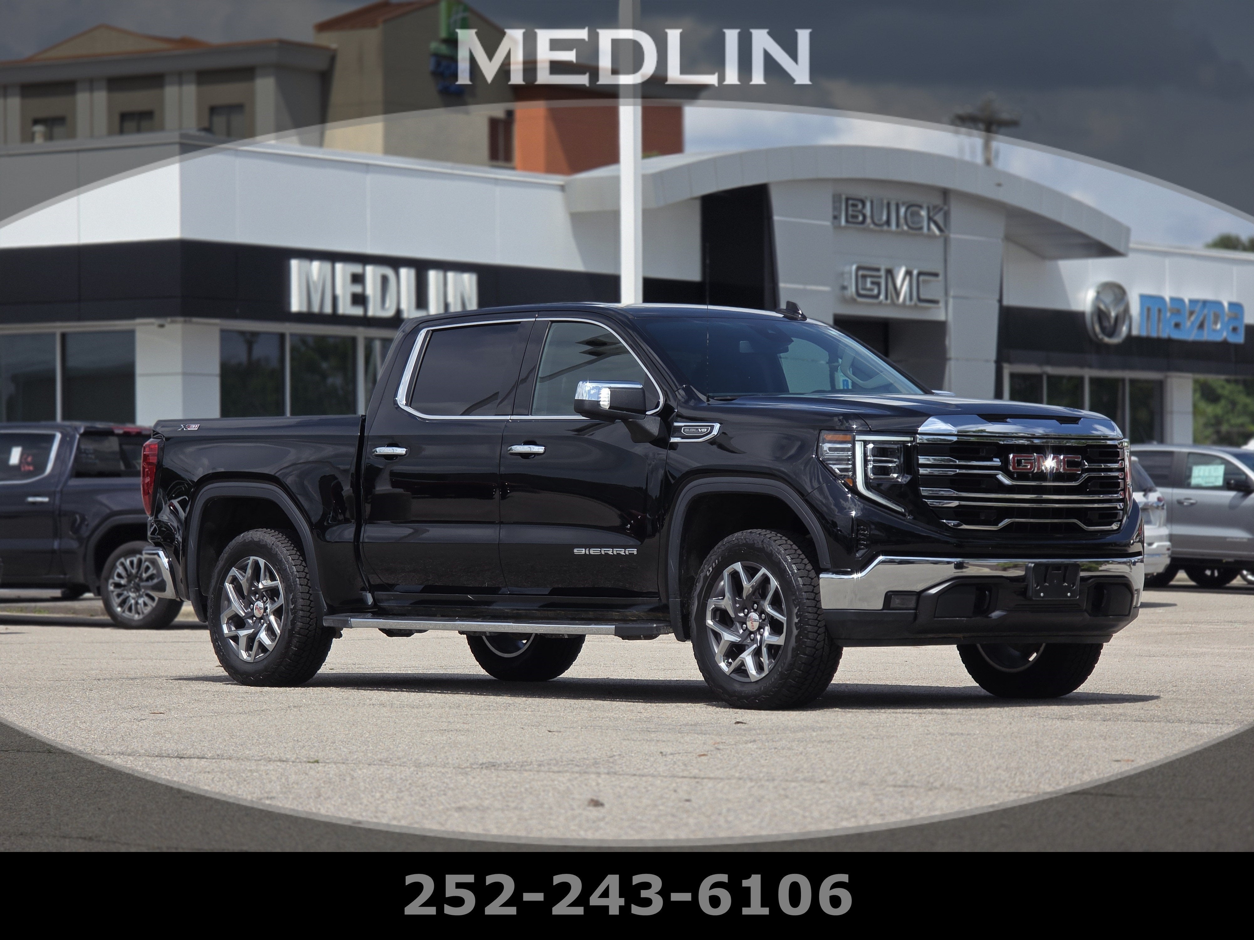 2024 GMC Sierra 1500 SLT in Onyx Black — front three-quarter view