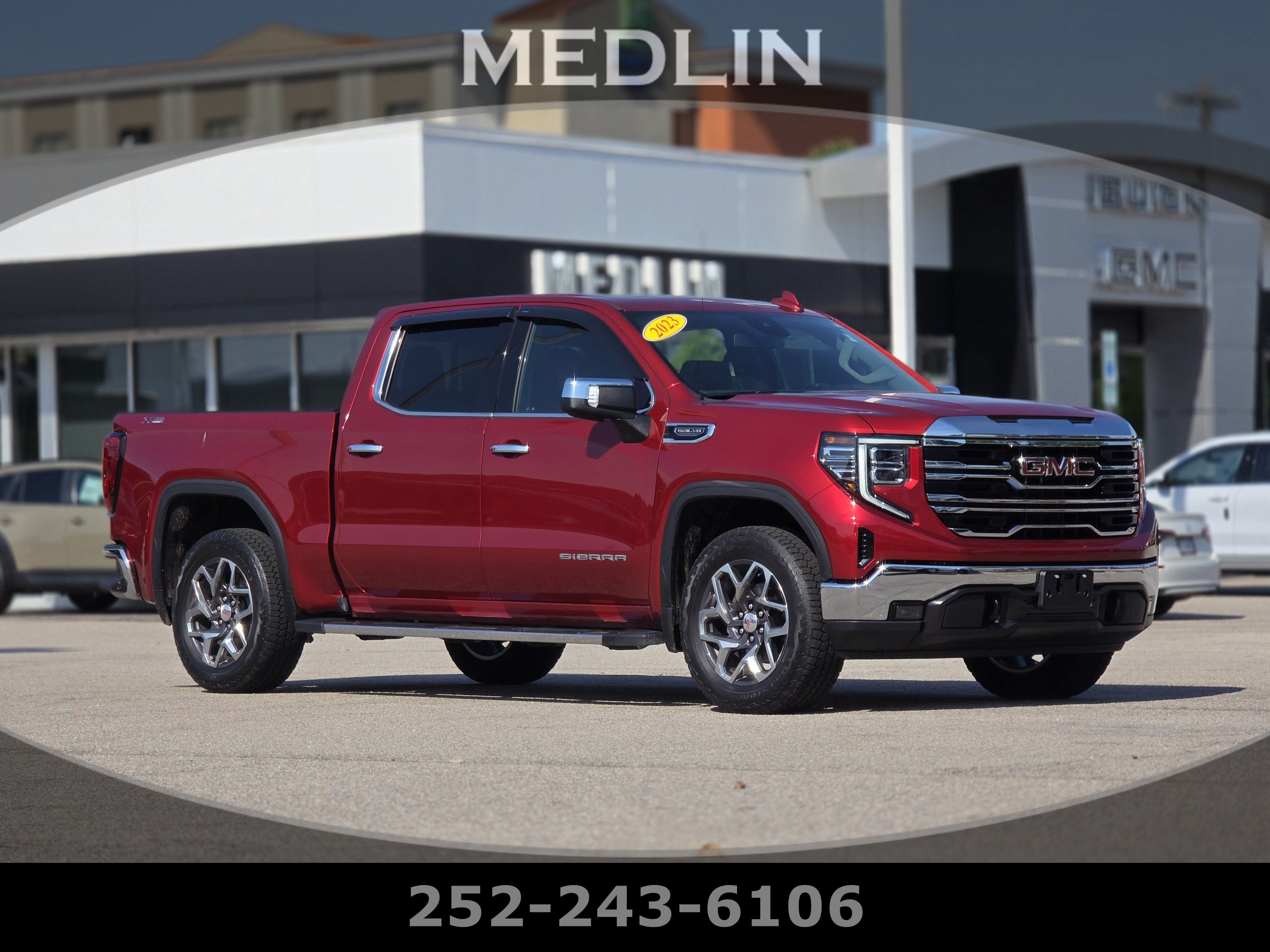 2023 GMC Sierra 1500 SLT in Volcanic Red Tintcoat — front three-quarter view