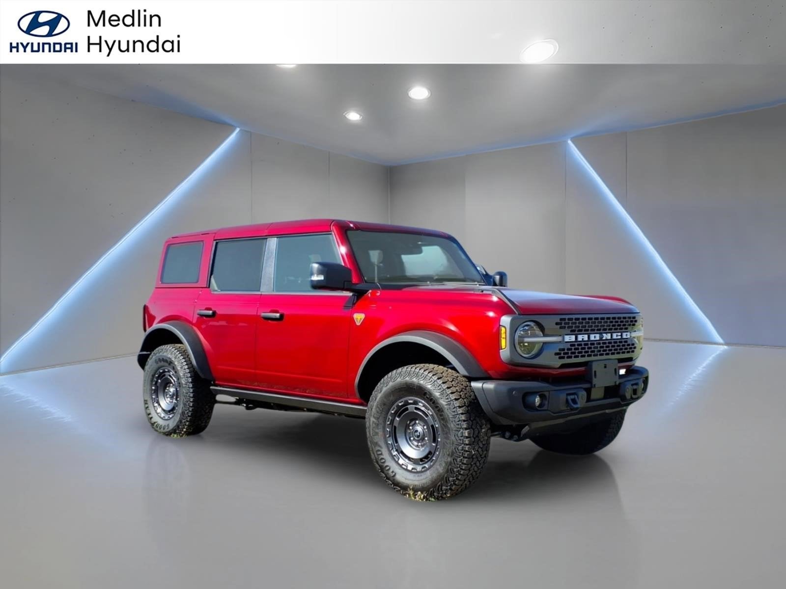 2025 Ford Bronco Badlands in Ruby Red Metallic — front three-quarter view